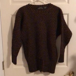 100% black and rust brown crew neck wool sweater. Size medium.